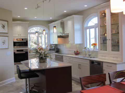 A uniquely shaped island gives a more contemporary feel to this Pennington, NJ kitchen design